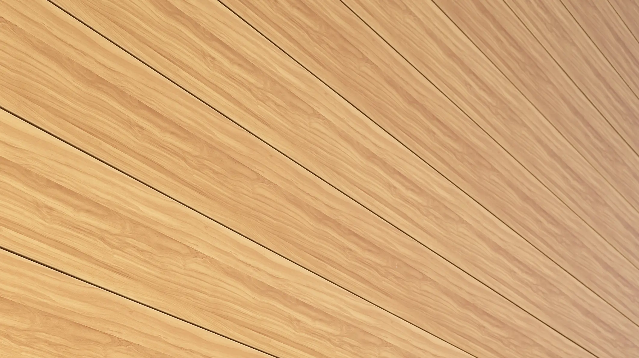 Detailní pohled na fasádní lamely PREFA Siding v barvě přírodního dubu
