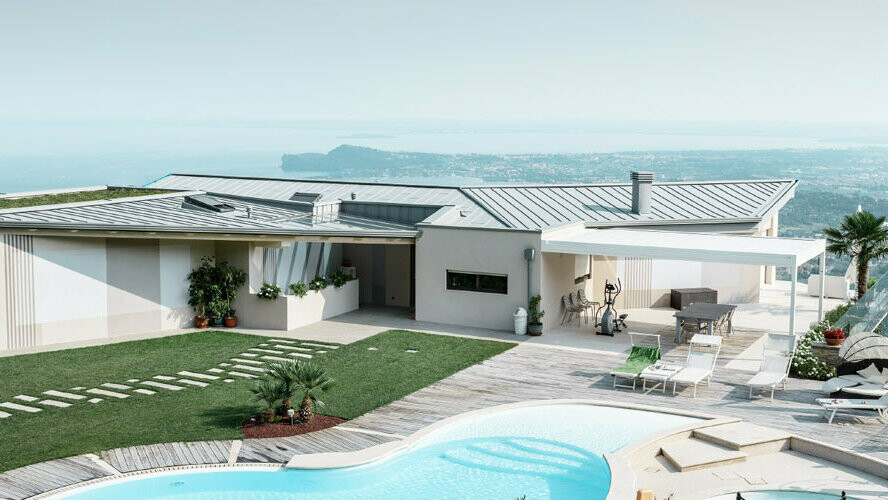 Jedinečně umístěný obytný dům s bazénem. Plochá střecha moderní budovy je pokryta materiálem Prefalz v barvě patina šedá.